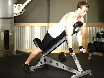 Barbell Curls Lying Against An Incline