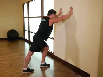 Correct form for the Calf Stretch Hands Against Wall
