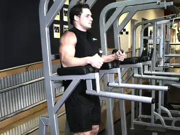 Correct form for the Knee/Hip Raise On Parallel Bars