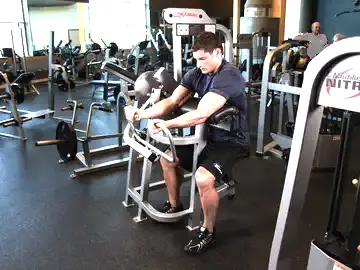 Correct form for the Machine Preacher Curls