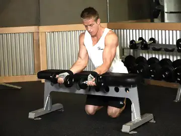 Correct form for the Palms-Up Dumbbell Wrist Curl Over A Bench