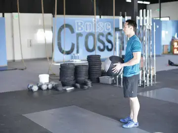 Correct form for the Standing Two-Arm Overhead Throw
